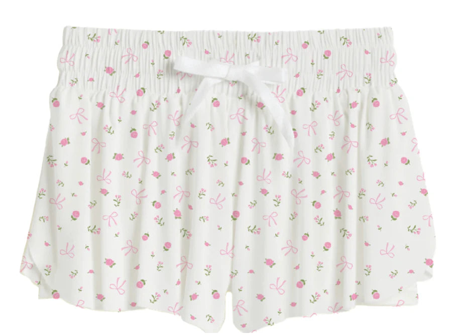 Floral patterned skirt with a white ribbon on a white background