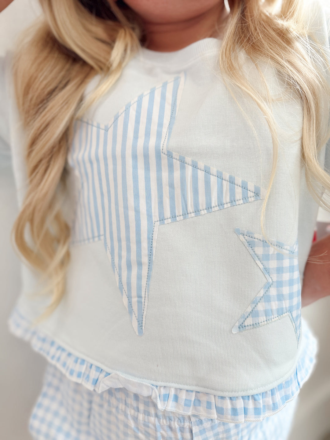 Star Applique Ruffle Hem Top